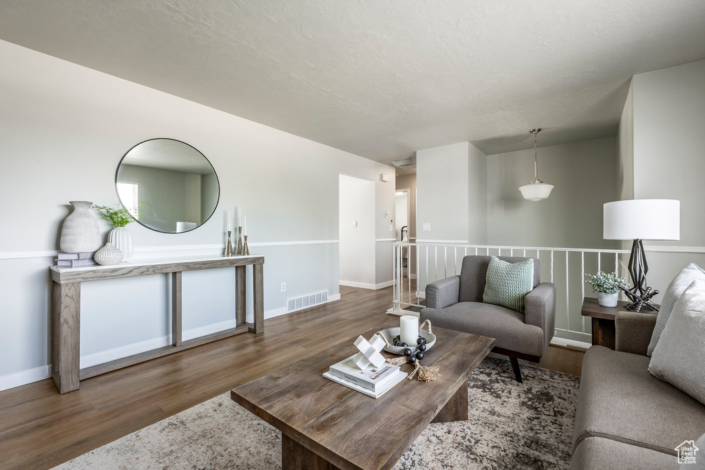 Living room featuring wood finished floors and baseboards