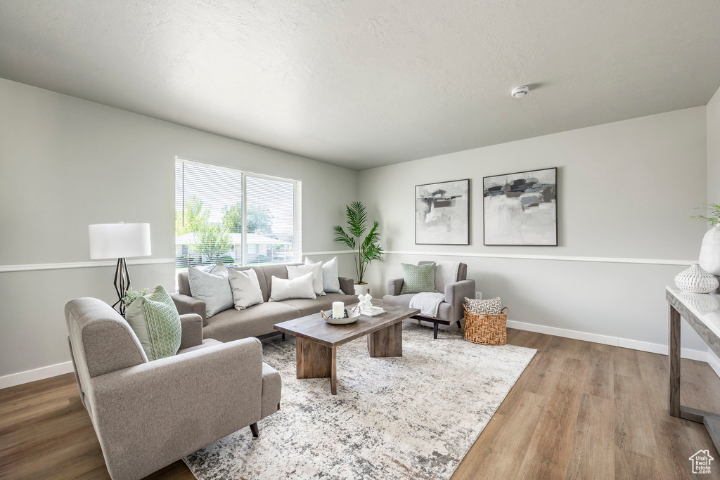 Living room featuring baseboards and wood finished floors