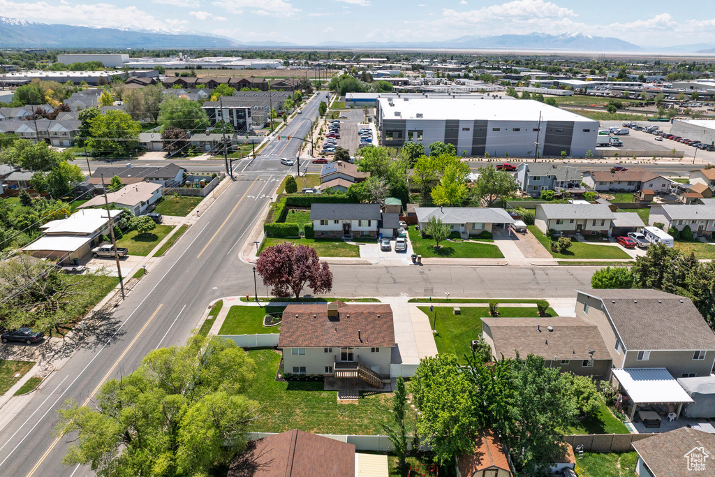 Aerial perspective of suburban area with a mountainous background