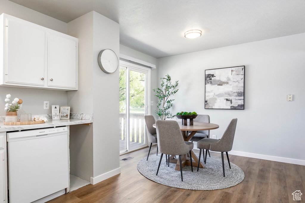 Dining room with wood finished floors and baseboards