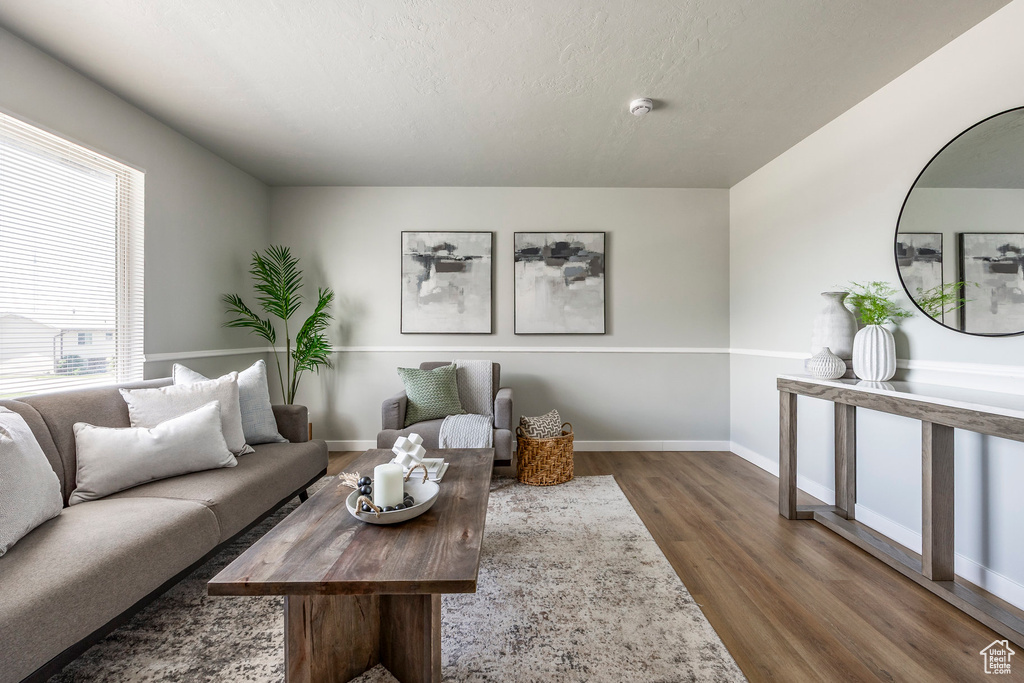Living area featuring wood finished floors and baseboards
