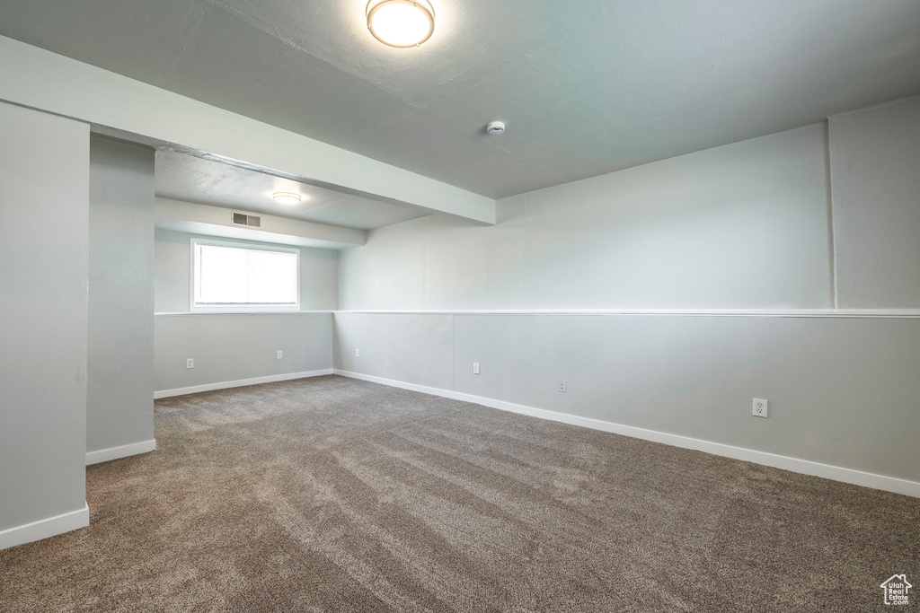 Below grade area featuring carpet floors and baseboards