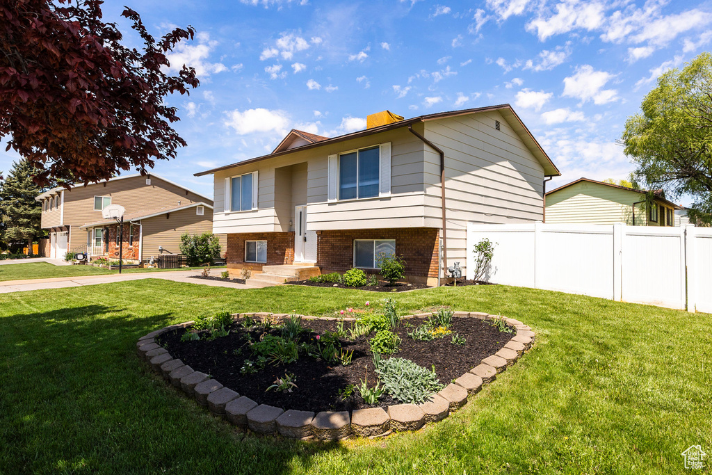 Split foyer home featuring brick siding