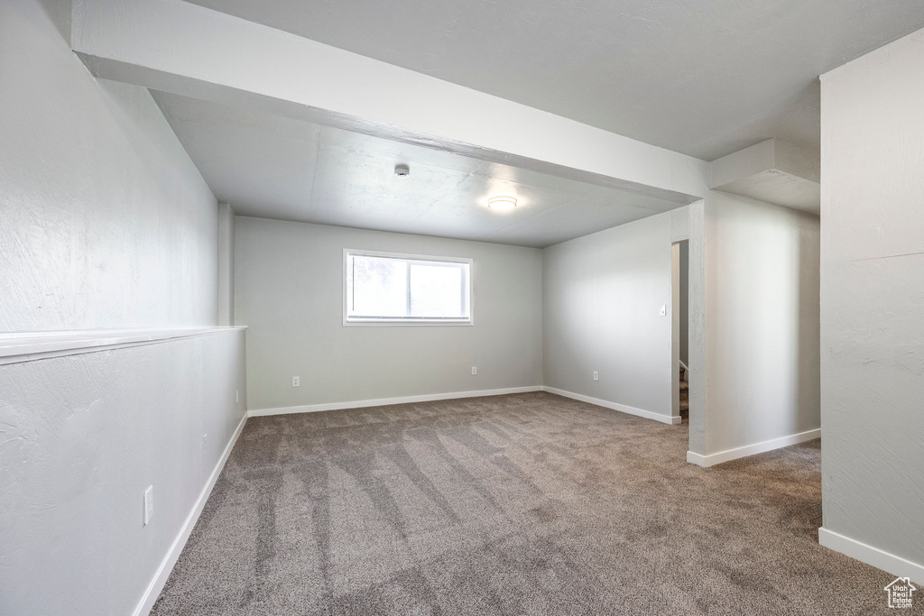 Basement with carpet and baseboards