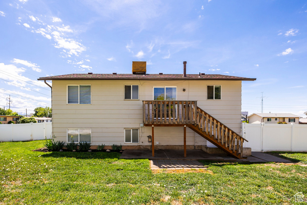 Rear view of house featuring a patio area and stairway