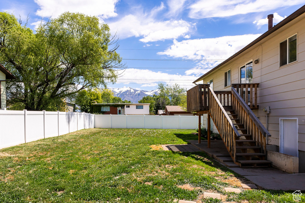 View of yard featuring a mountain view and stairs
