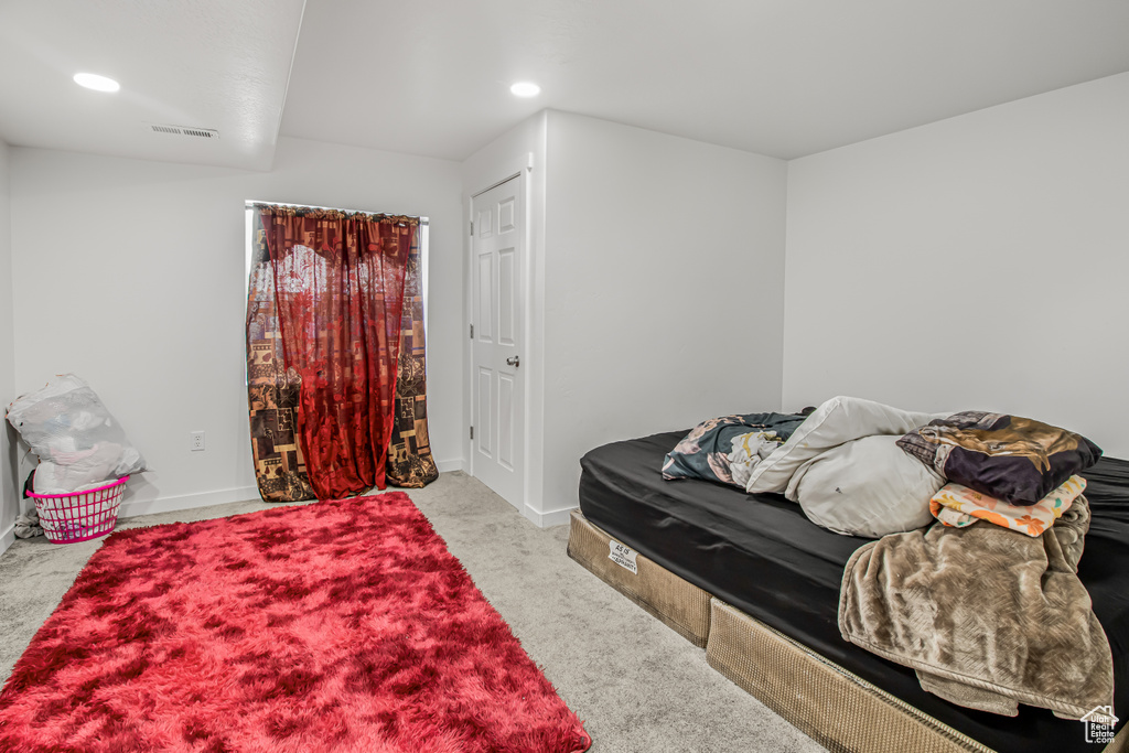 Bedroom featuring carpet flooring, recessed lighting, and baseboards