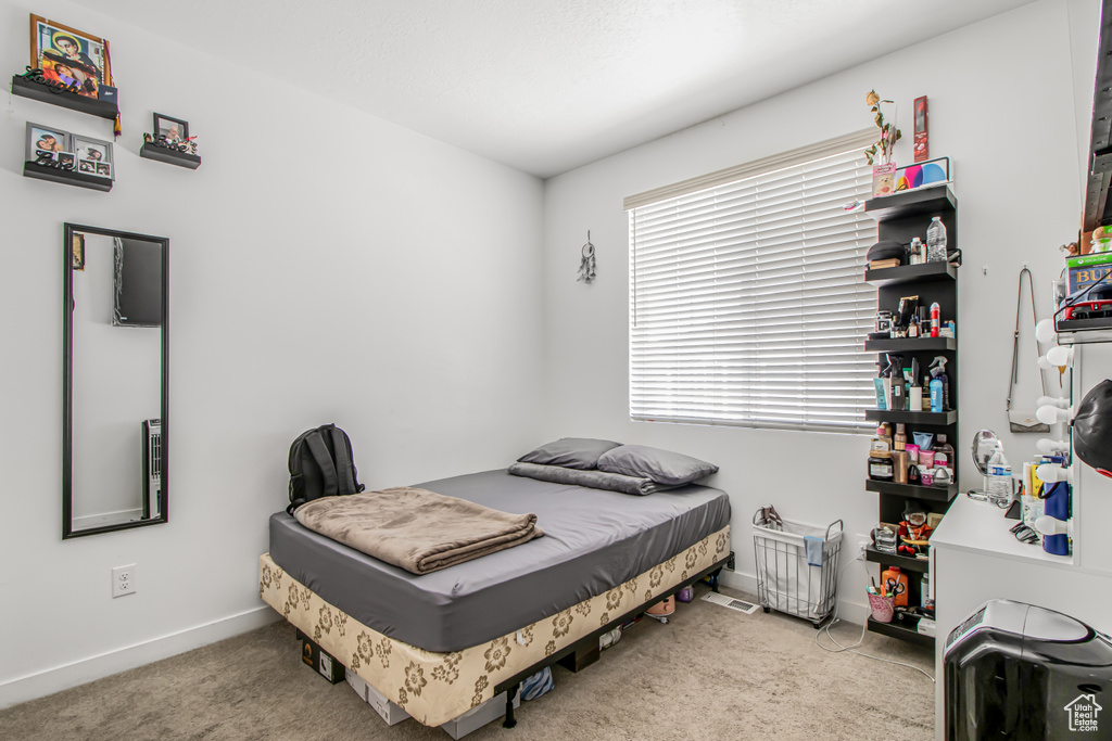 Bedroom with carpet and baseboards