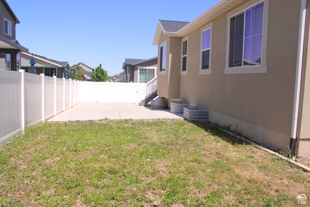 View of yard with a patio