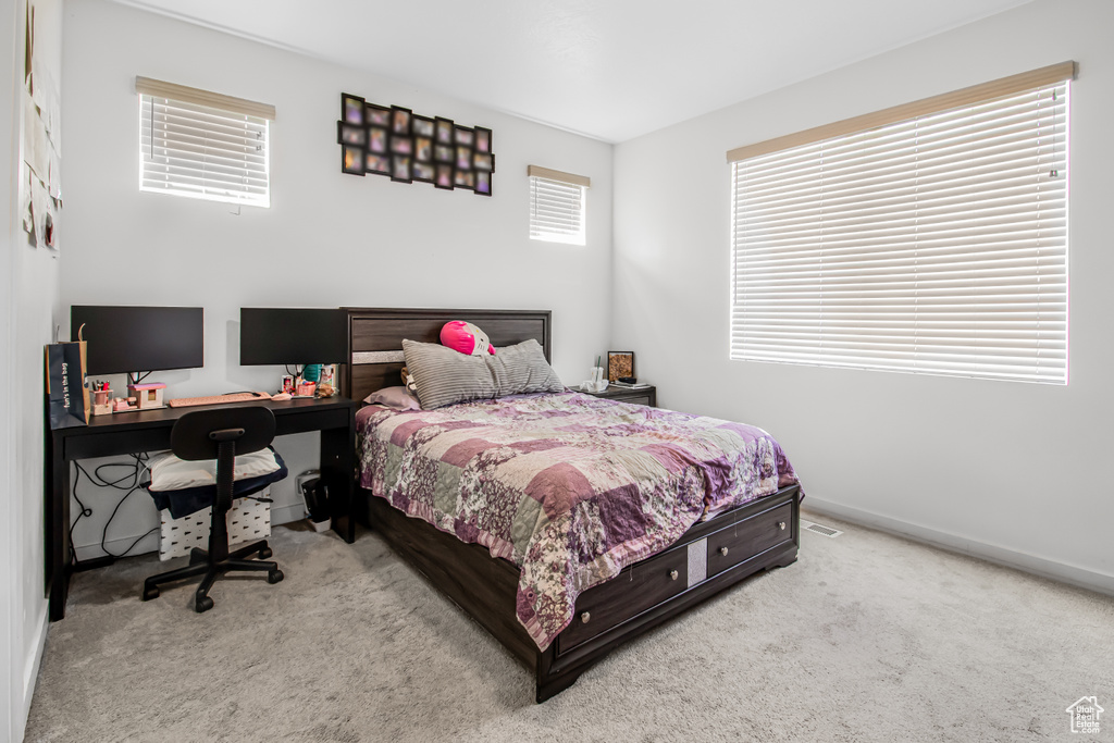 Bedroom with carpet and baseboards