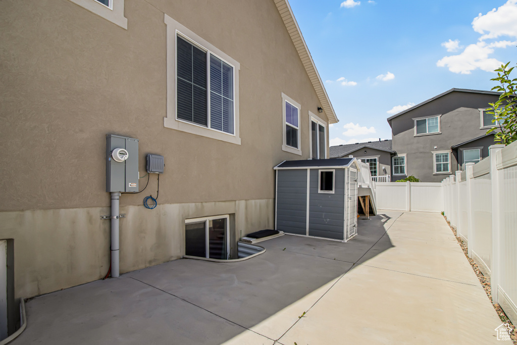 Fenced backyard with a patio area