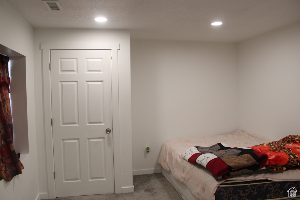 Bedroom featuring carpet flooring, recessed lighting, and baseboards