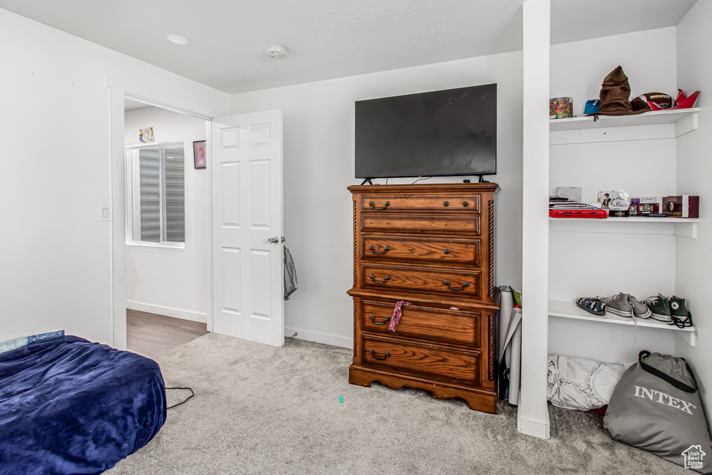 Bedroom with carpet floors and recessed lighting