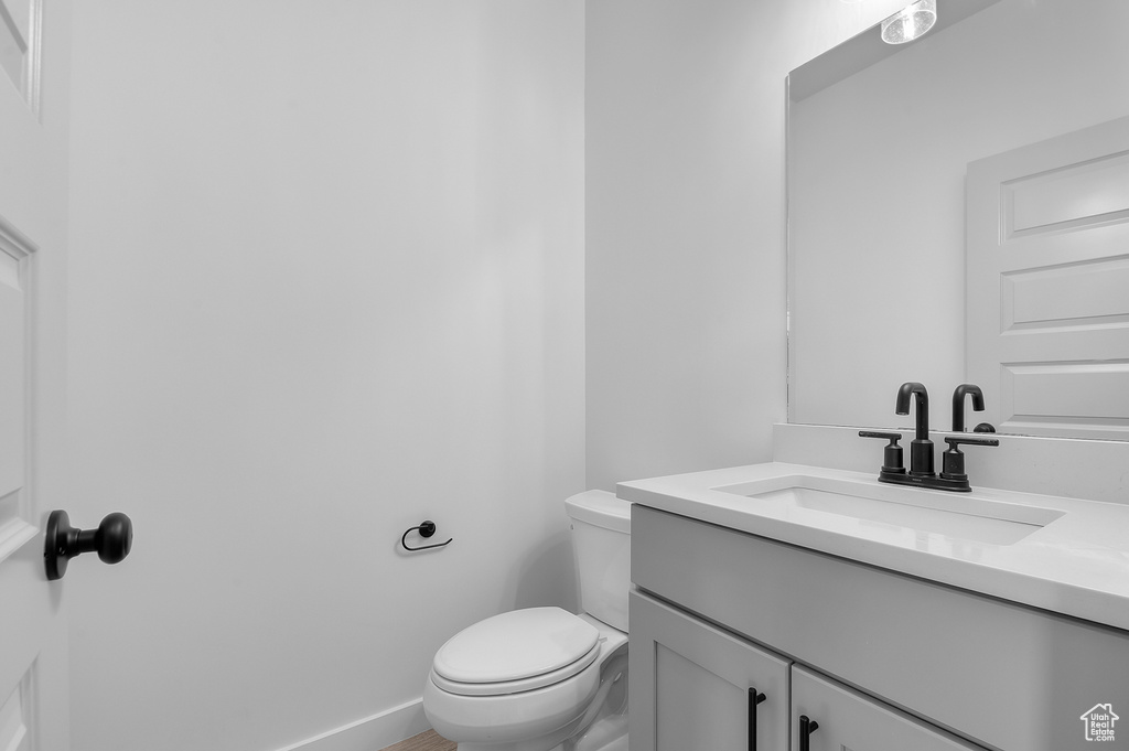 Bathroom featuring toilet and vanity