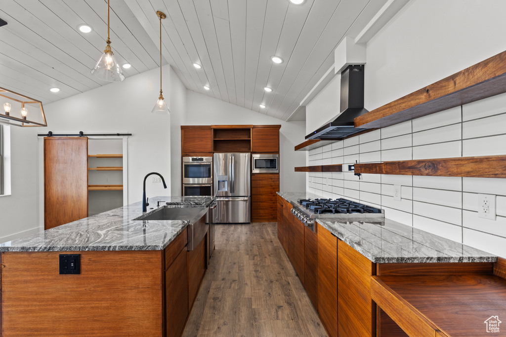 Kitchen featuring open shelves, appliances with stainless steel finishes, modern cabinets, a sink, and recessed lighting