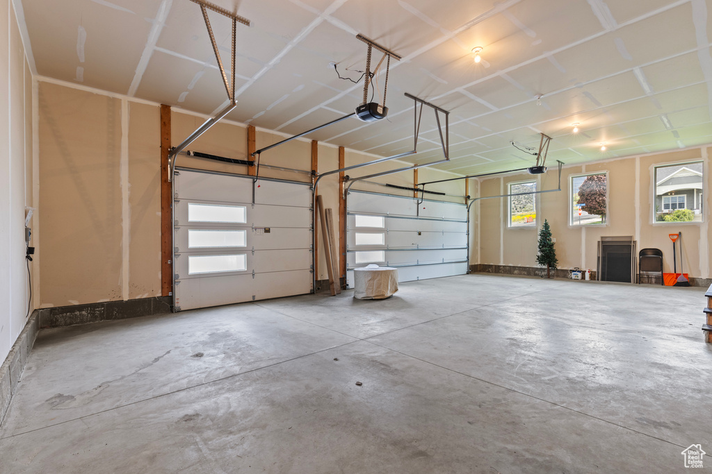 Garage featuring a garage door opener