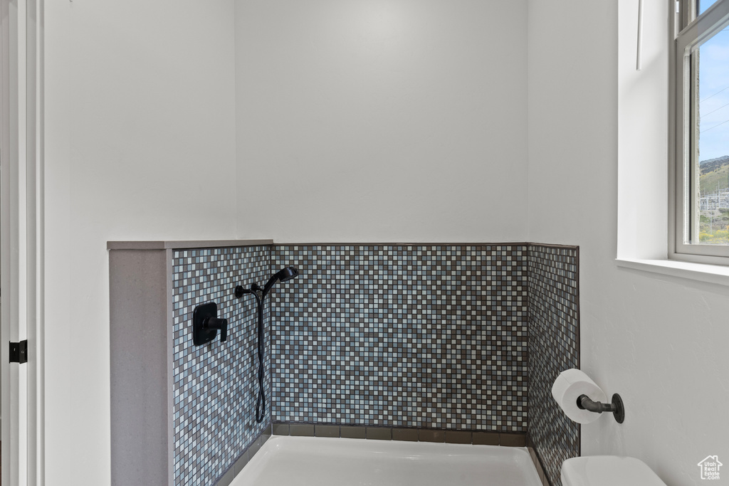 Bathroom featuring tiled shower
