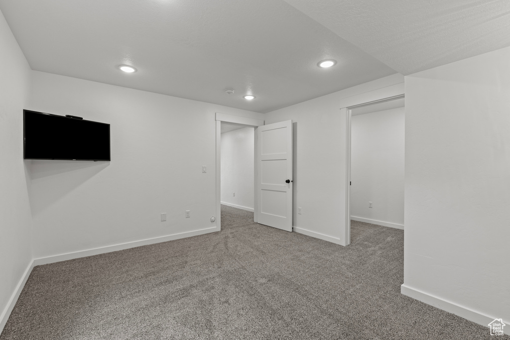 Basement featuring recessed lighting, carpet, and baseboards