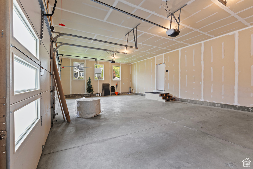 Garage featuring a garage door opener