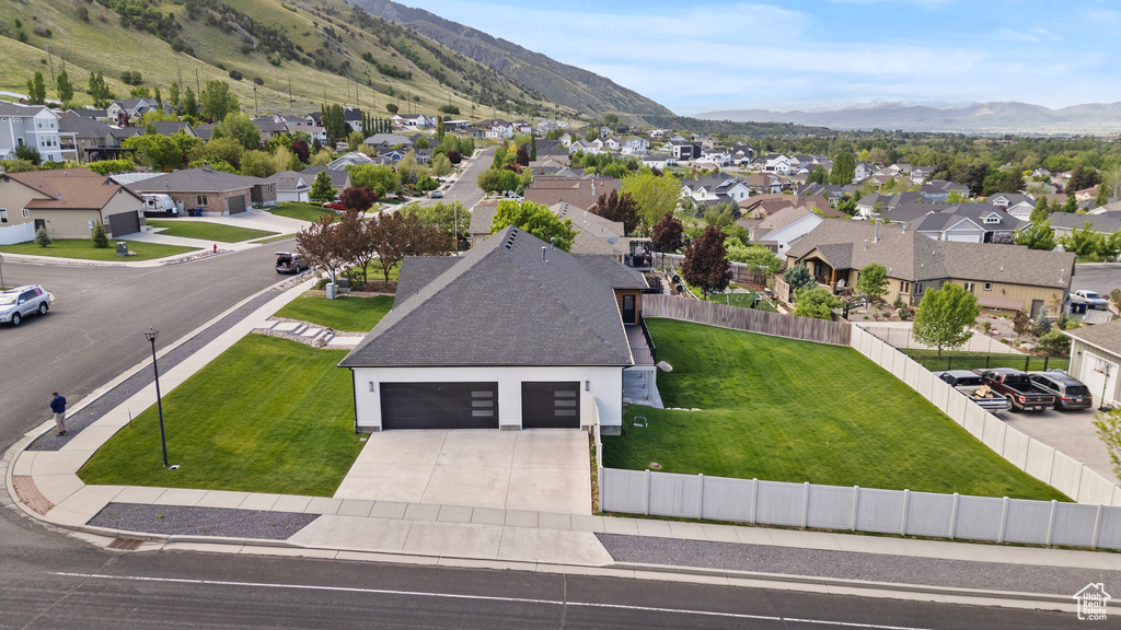 Aerial perspective of suburban area with a mountain backdrop