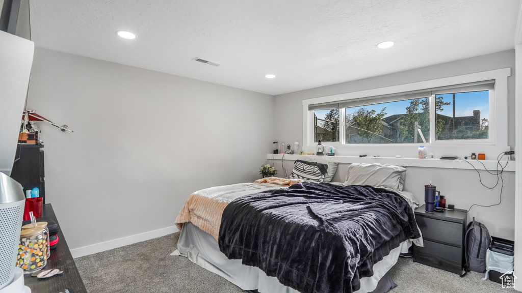 Bedroom with carpet floors, recessed lighting, and baseboards
