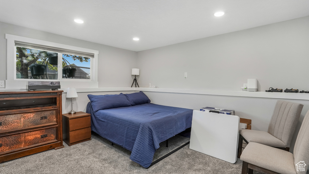 Carpeted bedroom with recessed lighting