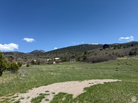 View of mountain backdrop featuring rural landscape