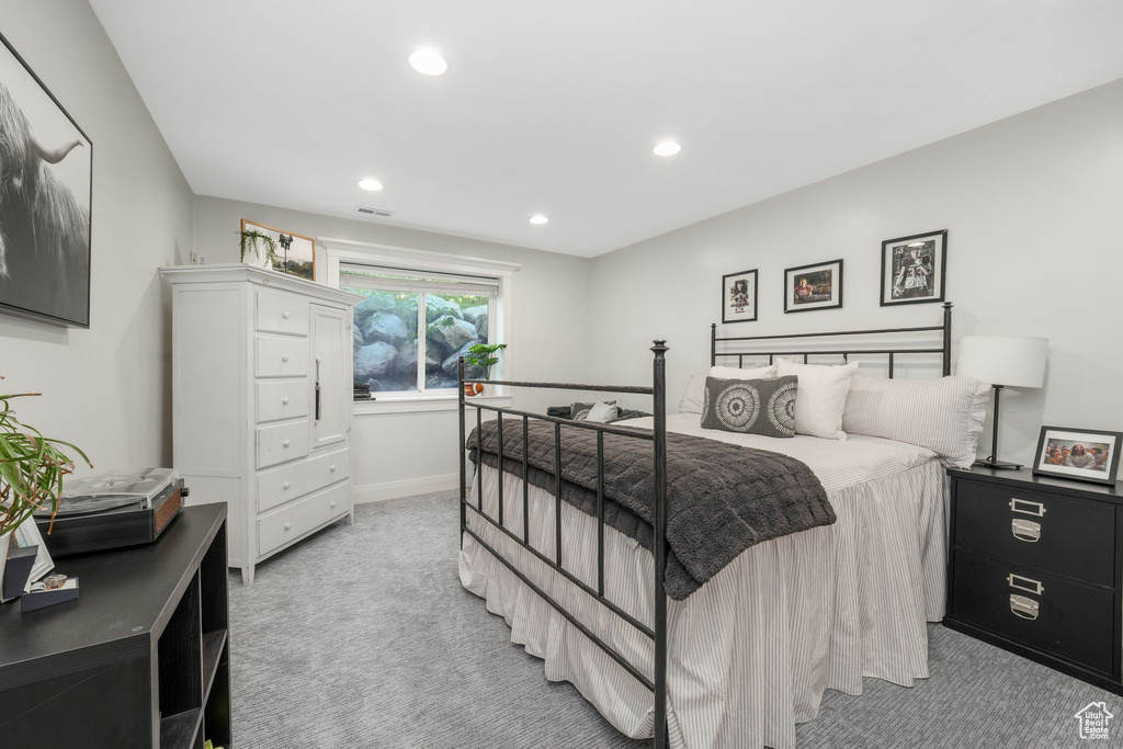 Bedroom featuring light colored carpet and recessed lighting