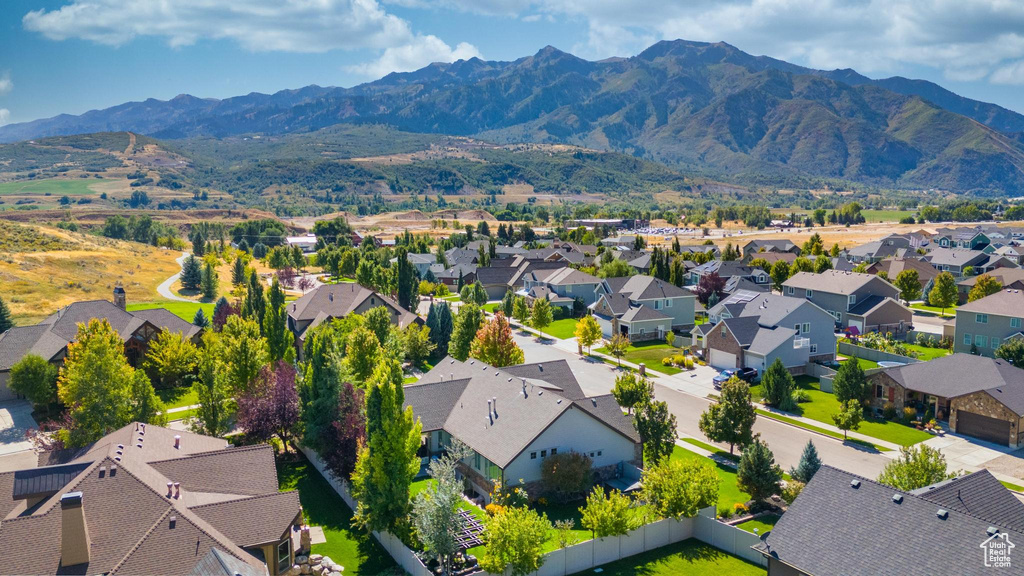 Aerial view of residential area featuring mountains