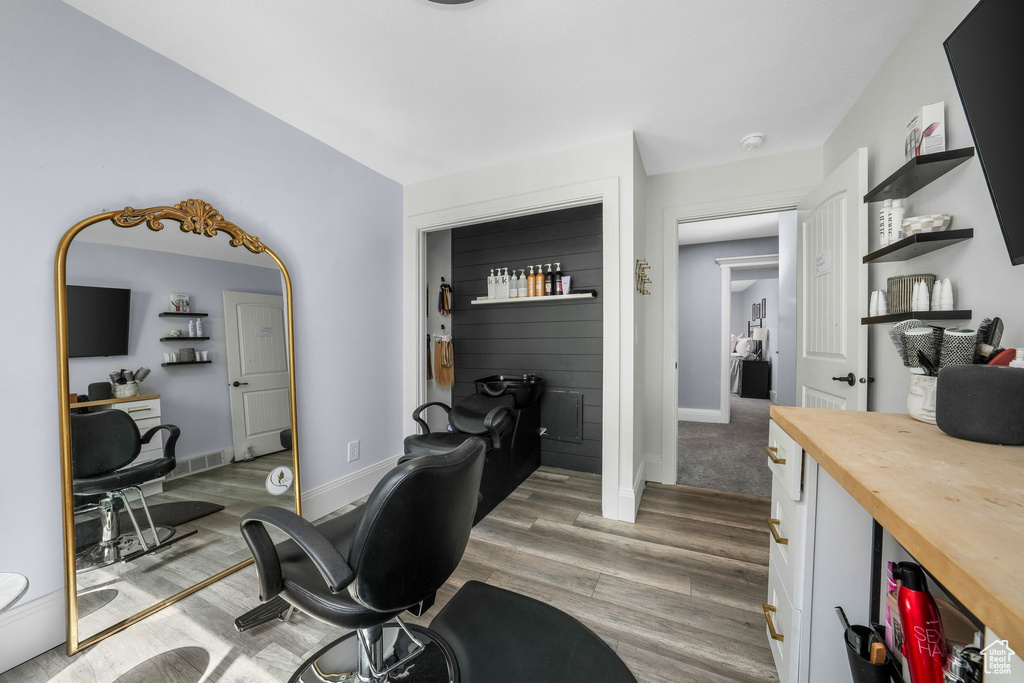 Home office with light wood-style floors and baseboards