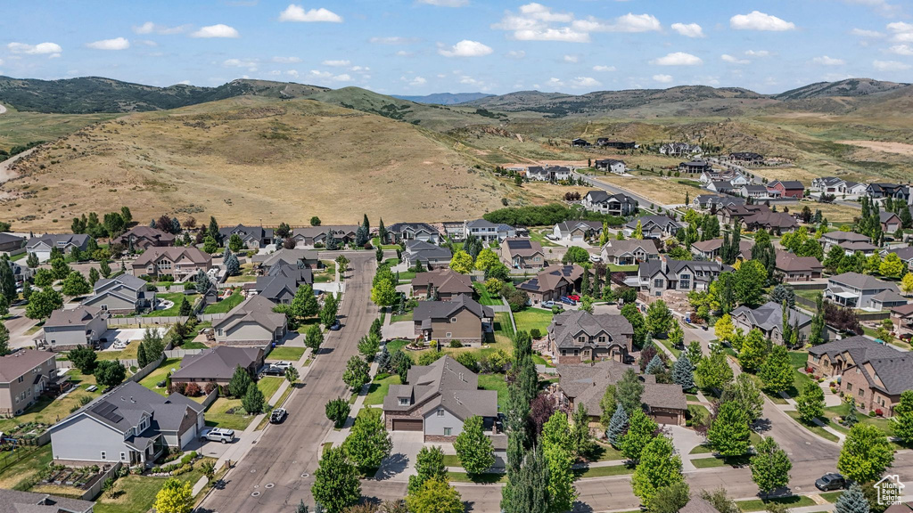 View of property location featuring nearby suburban area and mountains