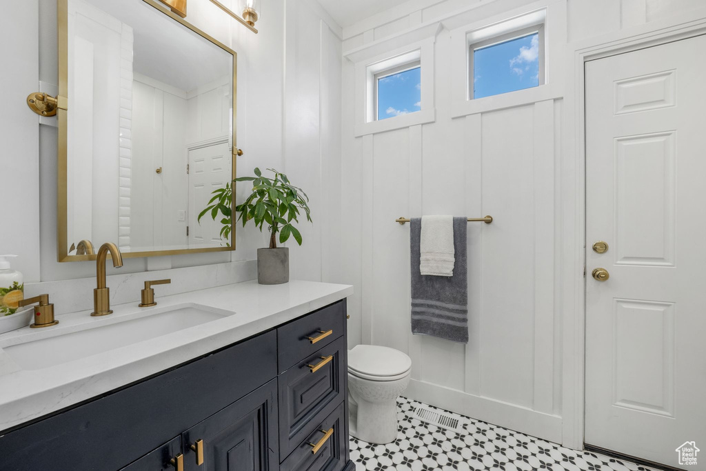 Bathroom with vanity and toilet