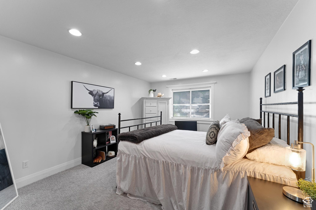 Bedroom with carpet floors, recessed lighting, and baseboards