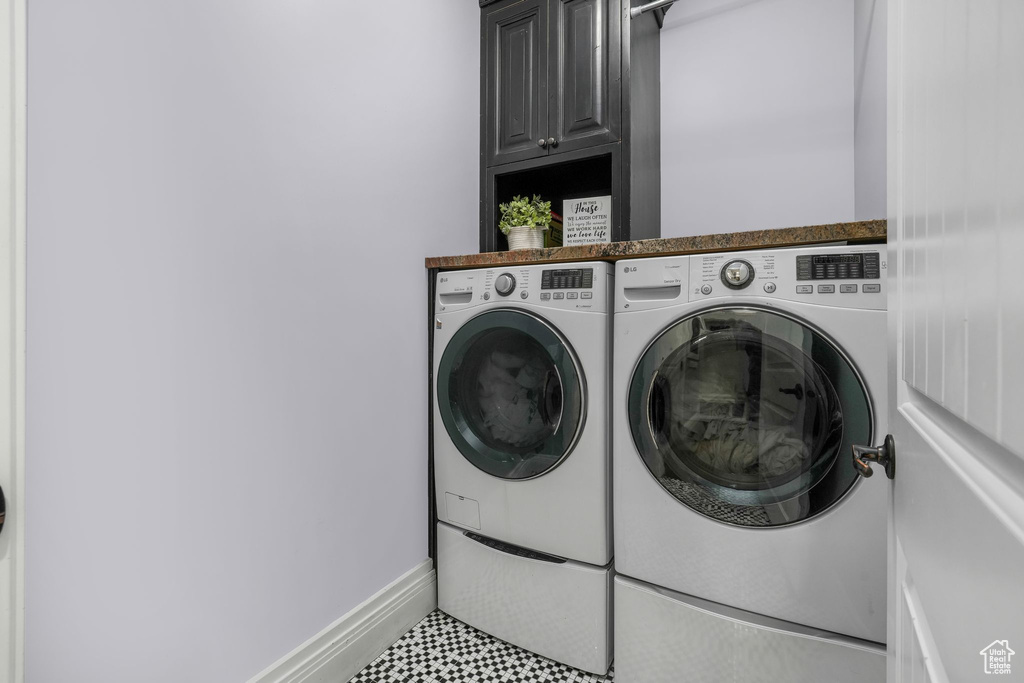 Laundry room with cabinet space and separate washer and dryer