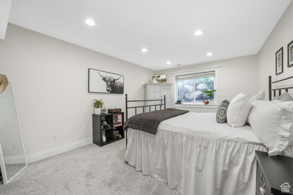 Bedroom featuring light colored carpet and recessed lighting