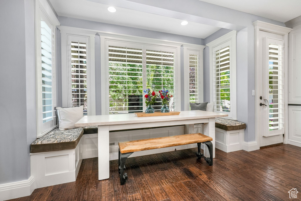 Dining area featuring breakfast area, dark wood-style floors, and recessed lighting