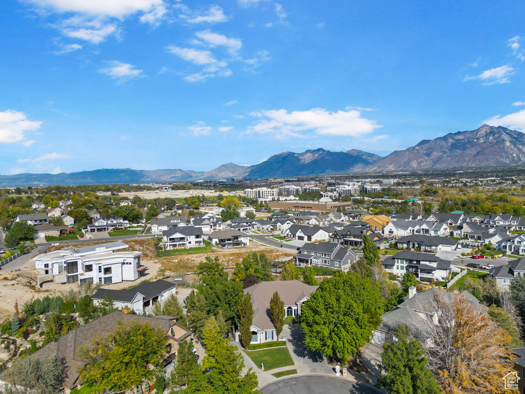 Aerial perspective of suburban area featuring a mountainous background