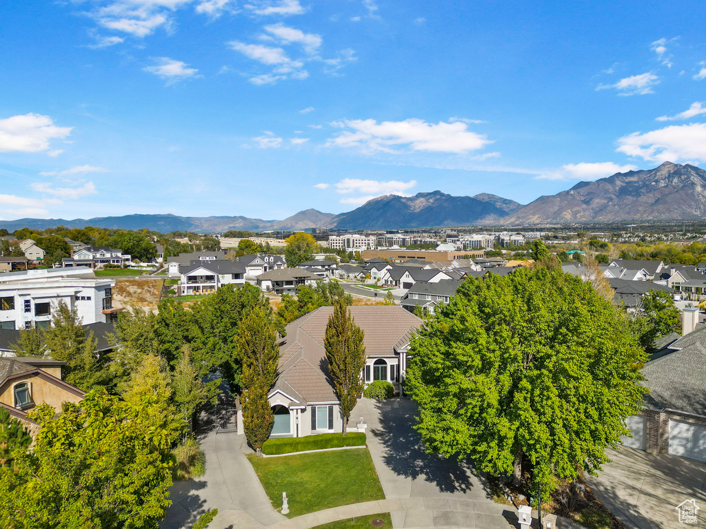 Aerial perspective of suburban area with a mountainous background