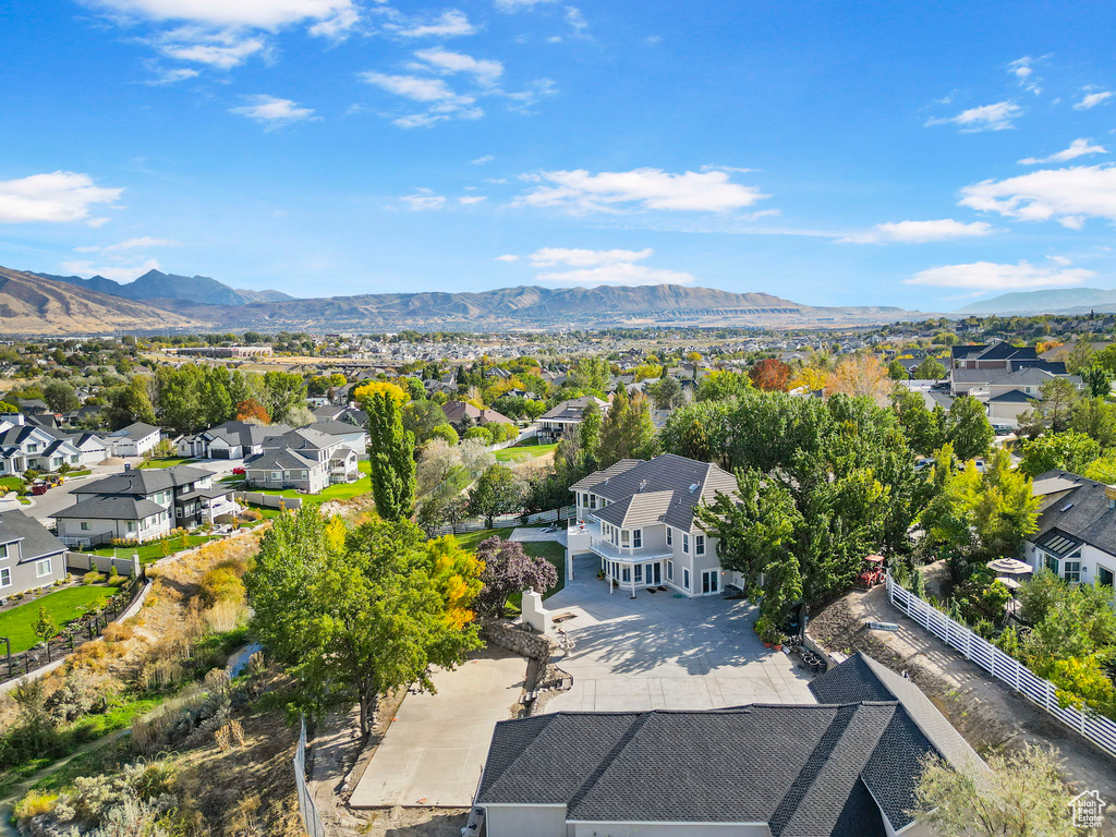 Aerial perspective of suburban area with a mountain backdrop