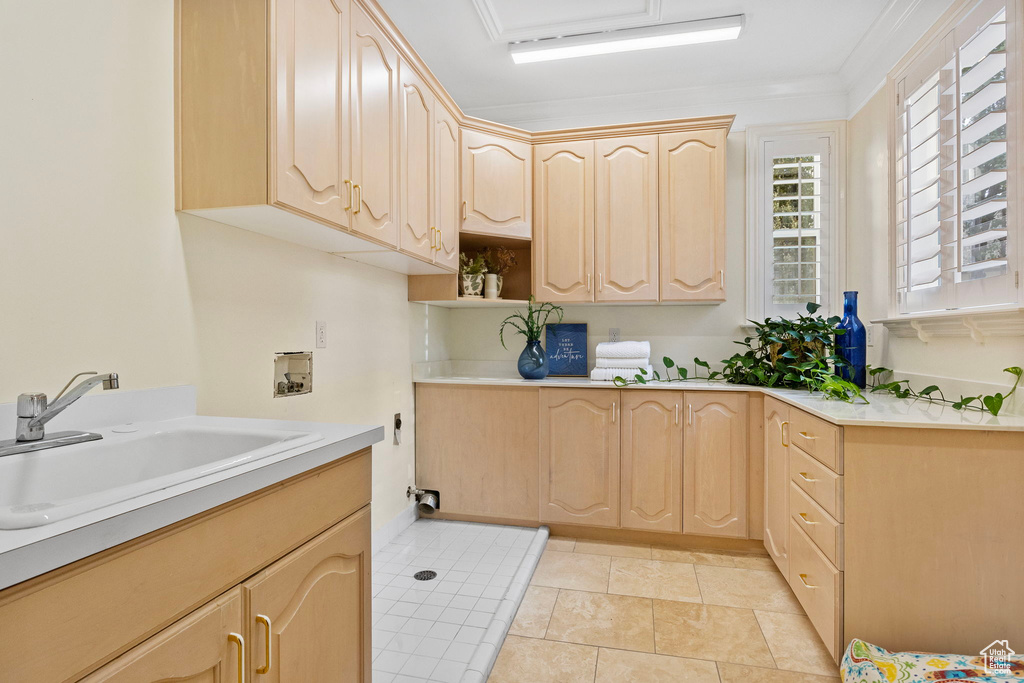 Laundry area with hookup for a washing machine and cabinet space