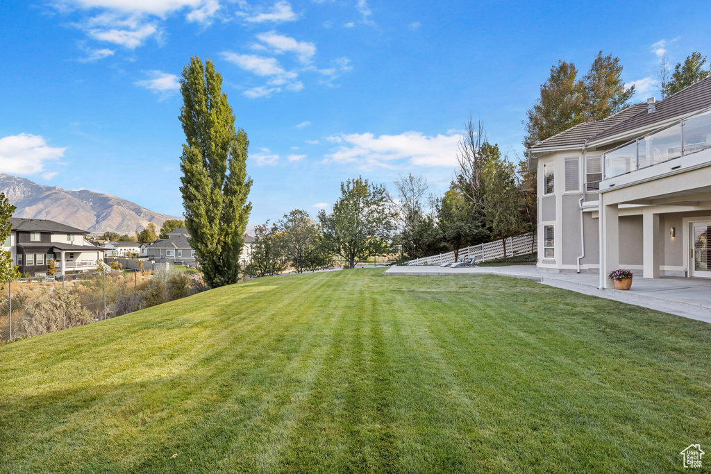 View of yard with a mountain view and a patio