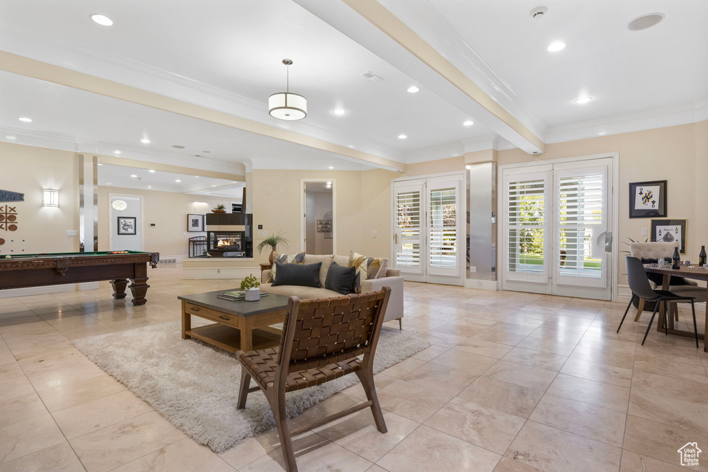 Building lobby with ornamental molding, beamed ceiling, and recessed lighting