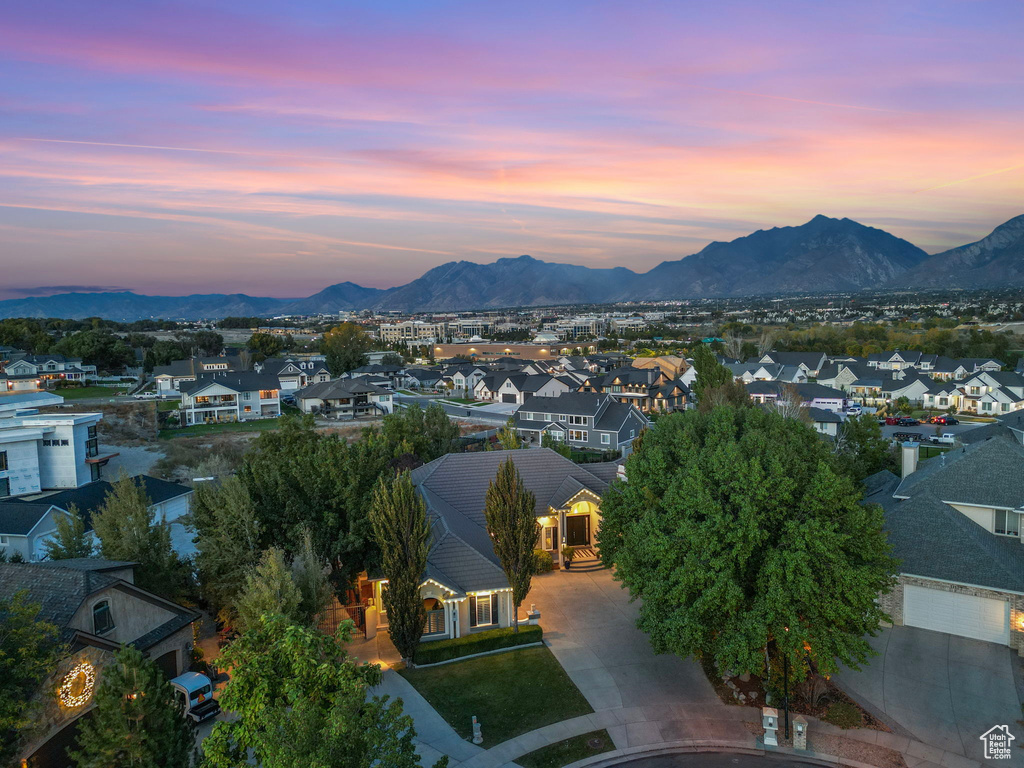 Aerial view of residential area featuring a mountain backdrop
