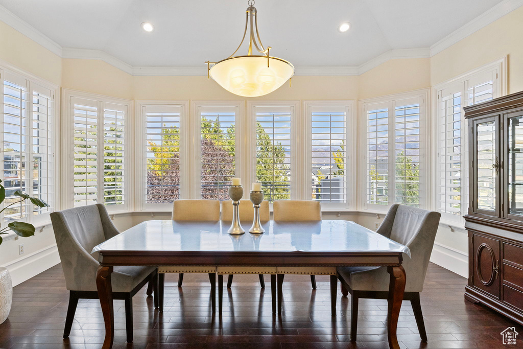 Dining room featuring recessed lighting, dark wood-type flooring, baseboards, and crown molding