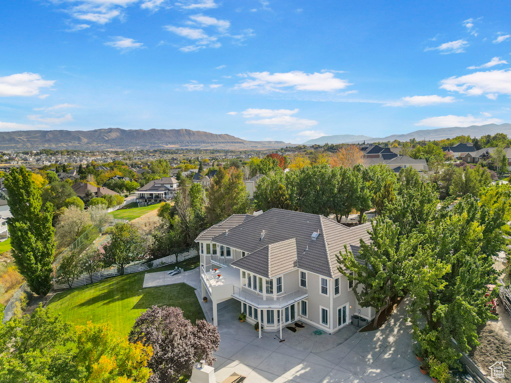 Aerial view of residential area featuring mountains