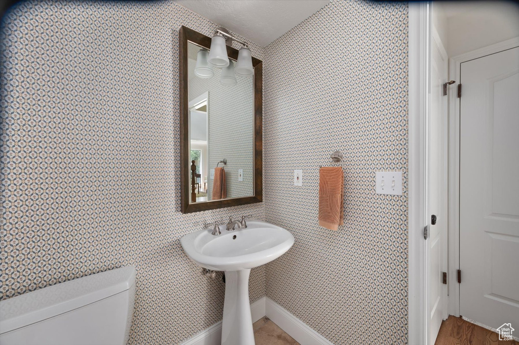 Bathroom featuring toilet and a sink
