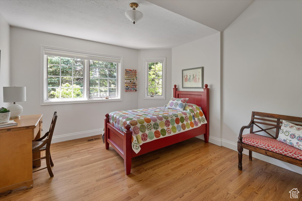 Bedroom featuring baseboards and light wood-style flooring