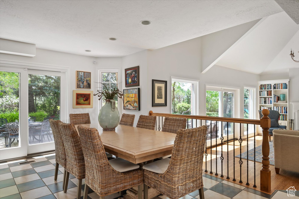 Dining space with lofted ceiling
