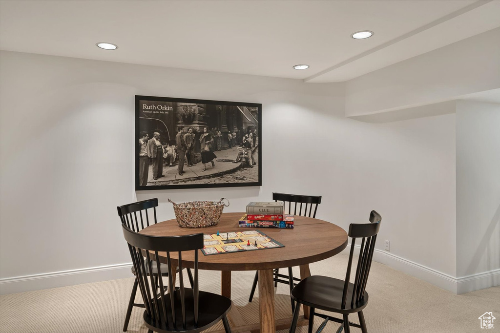 Carpeted dining room featuring recessed lighting and baseboards