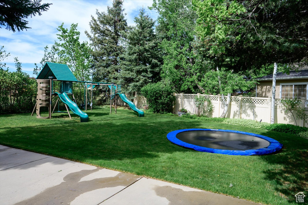 Community jungle gym featuring a trampoline